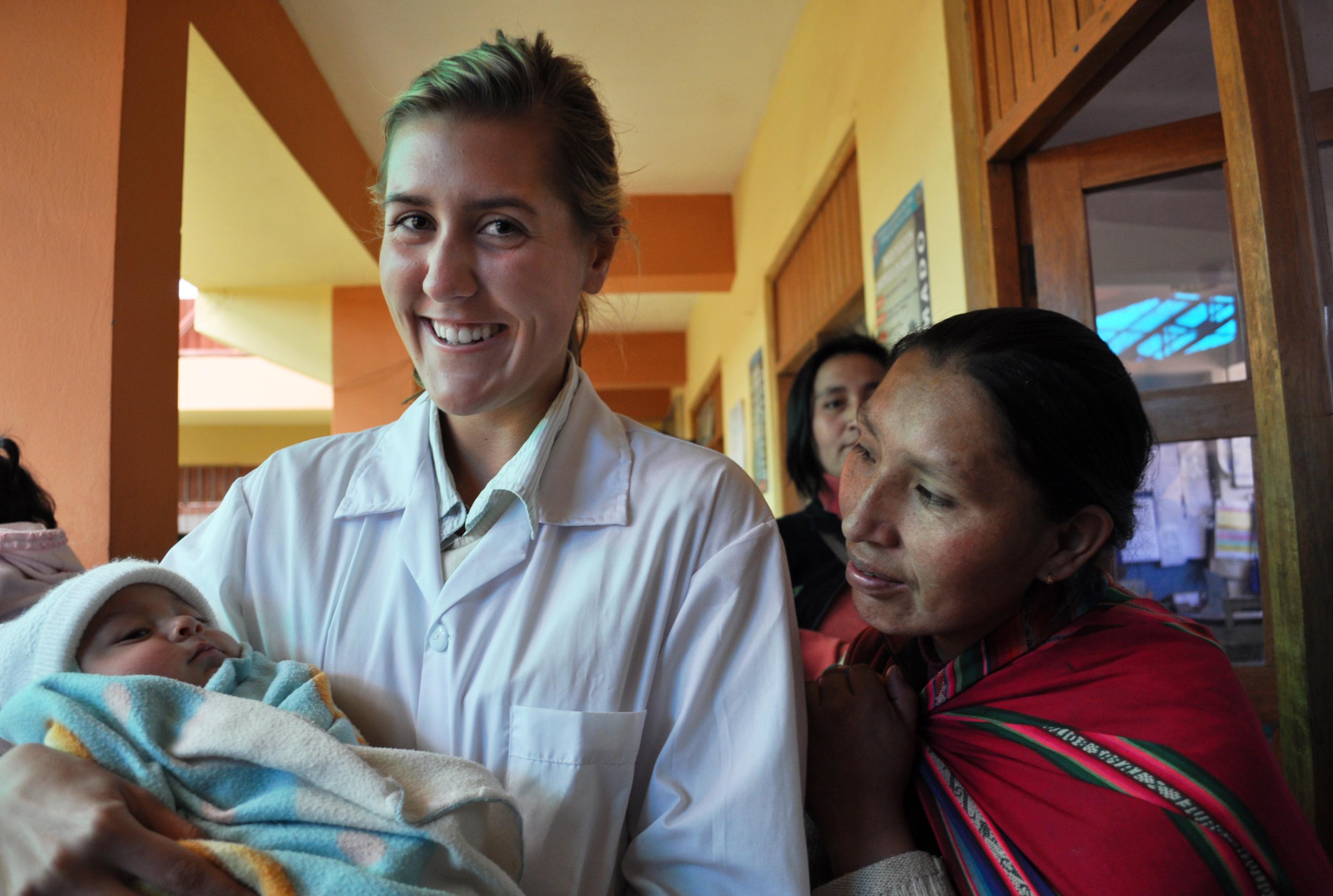 A new-born baby is pictured with a Projects Abroad intern whilst on her midwifery internship in Peru. An intern from Projects Abroad is pictured holding a new-born baby whilst on her midwifery internship in Peru.